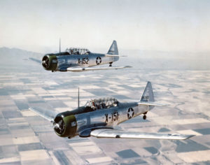 1280px-AT-6C_Texans_in_flight_1943